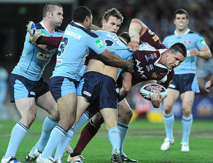 Queensland prop Steve Price is tackled during Queensland v New South Wales State of Origin Game. AAP Image/Dave Hunt