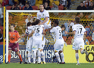 Gold Coast players react after Jason Culina scored in the 59th minute to put the Coast 2-0 up during the 1st round A-League football match between Brisbane Roar and Gold Coast United at Suncorp Stadium in Brisbane, Saturday, Aug. 8, 2009. (AAP Image/Dave Hunt)