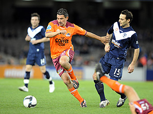 Melbourne Victory's Tomislav Pondeljak tackles Brisbane Roar's Charlie Miller, during round 2 of the A-League Season, played at the Ethihad stadium in Melbourne, Saturday, August 15, 2009. After full time, Victory drew with Brisbane Roar 3-3. AAP Image/Joe Castro