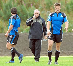 New Zealand All Black coach Graham Henry, center, flanked by Byron Kelliher, left and Richie McCaw during a training session in Edinburgh, Scotland, Friday, Sept 21, 2007. New Zealand are preparing for a Rugby World Cup Group C match against Scotland in Edinburgh. AP Photo/NZPA, Ross Setford