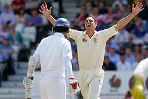Australia's Mitchell Johnson celebrates after taking the wicket of England's Graham Onions. AAP Images