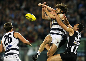 Geelong's Max Rooke attempts to mark against Collingwood's Simon Prestigiacomo (R) and Heath Shaw during the AFL 2nd Preliminary Final between the Geelong Cats and the Collingwood Magpies at the MCG. The Slattery Media Group