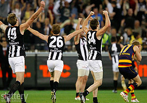 Collingwood players celebrate on the final siren of the AFL 1st Semi Final between the Collingwood Magpies and the Adelaide Crows at the MCG. Slattery Images