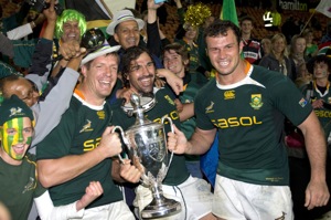 South Africa's Bakkies Botha, left, Victor Matfield and Bismarck du Plessis celebrate winning the Tri Nations Cup after defeating New Zealand in the Tri Nations International rugby match, Waikato Stadium, Hamilton, New Zealand, Saturday, Sept. 12, 2009. (AP Photo/NZPA, David Rowland)