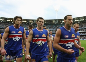 Western Bulldogs players leave the MCG after losing the AFL 2nd Qualifying Final to the Geelong Cats