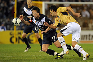 Melbourne Victory's Matthew Foschini in action against Newcastle Jets' Ljubo Milicevic during round 5 of the A-League Season, played at the Ethihad stadium in Melbourne, Thursday, Sept. 3, 2009. The Jets drew against Victory 1-1 after full time. AAP Image/Joe Castro