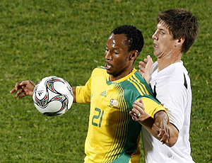 South Africa's Katlego Mashego, left, vies for the ball with New Zealand's Andy Boyens during their Confederations Cup Group A soccer match at the Royal Bafokeng Stadium in Rustenburg, South Africa, Wednesday, June 17, 2009. South Africa won 2-0. AP Photo/Rebecca Blackwell