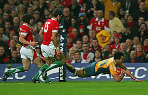 Australia's Digby Ioane, right, scores the first try against Wales during their international rugby union match at the Millennium Stadium in Cardiff, Wales, Saturday, Nov. 28, 2009. AP Photo/Tom Hevezi