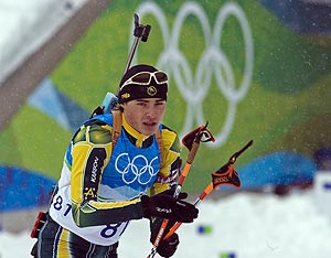 Australia's only biathlon competitor Alexei Almoukov heads from the shooting range. AP Photo/The Canadian Press, Andrew Vaughan