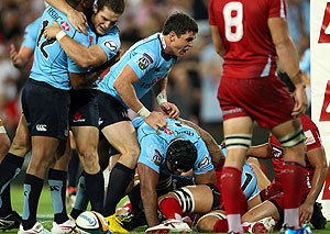Waratahs in action against the Reds