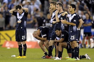 Melbourne Victory players react after missing a shot at goal during the penalty shoot out at the 2010 A-League Grand Final. AAP Image / Martin Philbey.