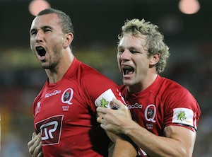 Queensland Reds players Quade Cooper (l) and Peter Hynes (r). AAP Image/Dave Hunt