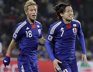 Japan's Keisuke Honda, Yasuhito Endo during the World Cup Group E soccer match between Denmark and Japan.