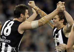 Collingwood's Darren Jolly and Dayne Beams celebrate a goal.