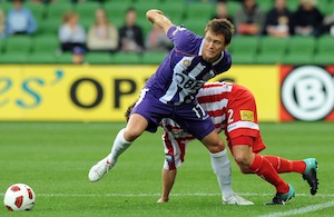 Perth Glory's Todd Howarth wins the ball against Melbourne Heart's Michael Marrone.