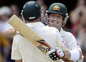 Australian batsman Brad Haddin (right) celebrates score 100 runs with Mike Hussey on the third day of the first Ashes test
