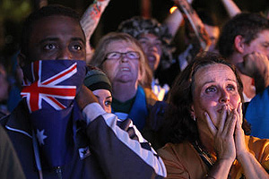Disappointed football fans watch a live broadcast of the announcement of the host country. AAP Image/Sergio Dionisio