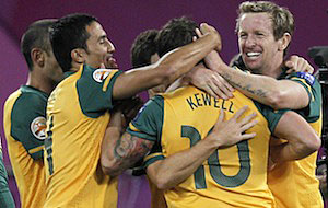Australia players celebrate after scoring a goal against Uzbekistan during their AFC Asian Cup semi-final