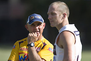Brisbane Broncos coach Ivan Henjak (left) looks at Darren Lockyer during the Broncos' team training session. AAP Image/Dave Hunt