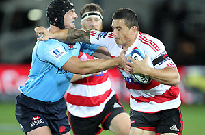 Sonny Bill Williams fends off the tackle of Dean Mumm