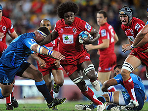 Reds player Radike Samo runs the ball during Super Rugby competition between the Queensland Reds and the Bulls from South Africa at Suncorp Stadium in Brisbane, Saturday, April 16, 2011. (AAP Image/Dave Hunt) 