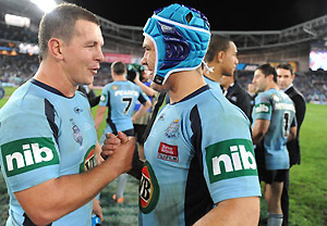 New South Wales Jamie Soward and Greg Bird celebrate their win over Queensland. AAP Image/Dean Lewins