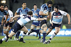 Ali Williams of the Blues looks to get past Josh Holmes of the Waratahs. AAP Images/NZPA, Wayne Drought