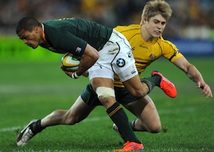 South Africa's Juan de Jongh steps through a tackle by Australia's James O'Connor during their Tri-Nations match