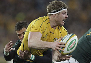 Australia's David Pocock front, is tackled by South Africa's Bjorn Basson during their Tri-Nations rugby match. 