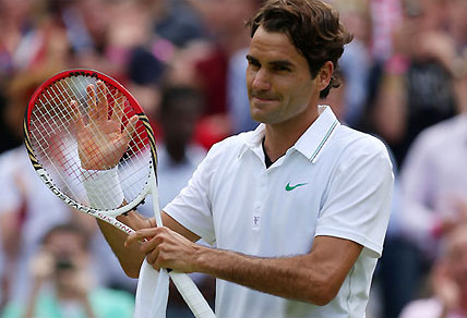 Roger Federer applauds his performance and the fans at Wimbledon