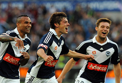 Marco Rojas of Melbourne Victory (centre) celebrates after scoring a goal against Newcastle Jets during the A League round 13, Melbourne Victory v Newcastle Jets, Friday, Dec. 28, 2012. (AAP Image/Joe Castro)