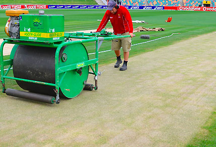 A groundsman on a heavy roller rolls the pitch ahead of the Test match