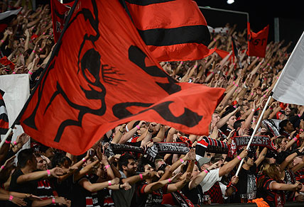 Western Sydney Wanderers fans celebrate the Wanderers 2-nil win over the Brisbane Roar during their semi-final match at Parramatta Stadium, Sydney, Friday, April 12, 2013. (AAP Image/Dean Lewins)