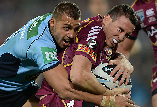 Maroons' Darius Boyd (right) is tackled by Blues' Blake Ferguson during Game I of the 2013 State of Origin