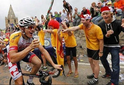 Aussie cyclist Adam Hansen stops for a beer during the Tour de France