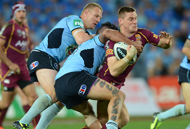 Queensland Maroons' Brent Tate is tackled during 2013 State of Origin Game 3