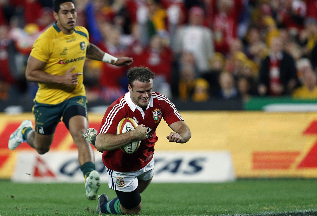 Jamie Roberts of the Lions crosses for a try. (Photo: Paul Barkley/LookPro)