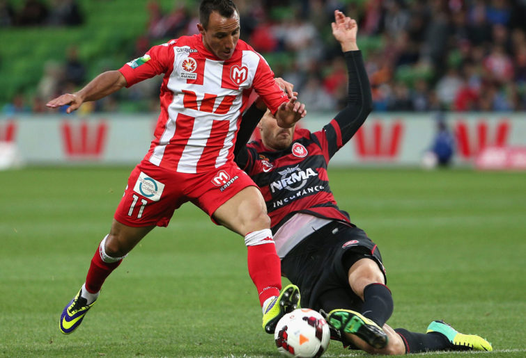 Michael Mifsud of the Heart competes with lacopo La Rocca of the Wanderers. (AAP Image/Mark Dadswell)