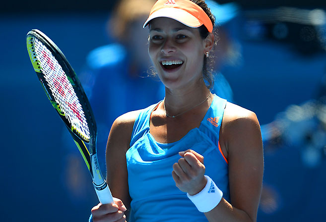 Ana Ivanovic celebrates after victory against Serena Williams AFP PHOTO / WILLIAM WEST