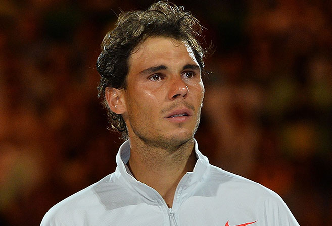 Spain's Rafael Nadal reacts after his loss against Switzerland's Stanislas Wawrinka during the men's singles final on day 14 of the 2014 Australian Open tennis tournament in Melbourne on January 26, 2014. AFP PHOTO / SAEED KHAN