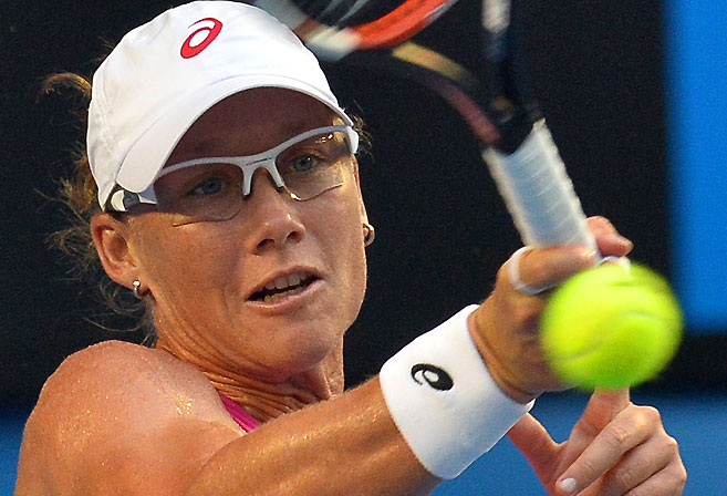Samantha Stosur returns at the Australian Open