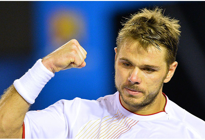 Switzerland's Stanislas Wawrinka reacts after a point against Spain's Rafael Nadal during the men's singles final on day 14 of the 2014 Australian Open tennis tournament in Melbourne on January 26, 2014. AFP PHOTO / SAEED KHAN