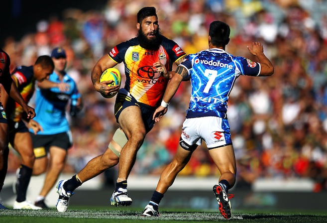 Cowboys' James Tamou makes a run at Warriors' Shaun Johnson in their semi final match. Day Two of the Dick Smith NRL Auckland Nines, Eden Park, Auckland, New Zealand. Sunday 16th February 2014. Photo: www.photosport.co.nz