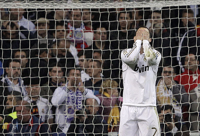 Real Madrid's Cristiano Ronaldo from Portugal reacts after falling to score a penalty kick during a shootout in a semifinal, second leg Champions League soccer match against Bayern Munich at the Santiago Bernabeu stadium in Madrid Wednesday April 25, 2012. (AP Photo / Franz Mann)