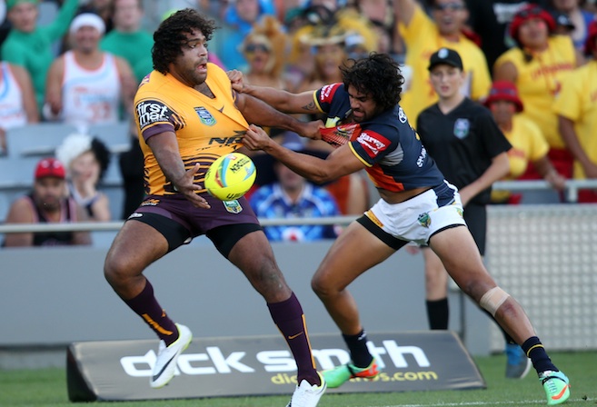 Sam Thaiday of the Broncos offloads under pressure from Javid Bowen of the Cowboys in the final on day two of the Dick Smith NRL Auckland Nines rugby league tournament at Eden Park in Auckland on 16 February 2014. Photo: www.photosport.co.nz