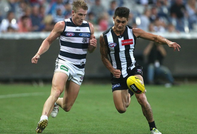 Josh Caddy of the Cats competes with Marley Williams of the Magpies. (AAP Image/Mark Dadswell)