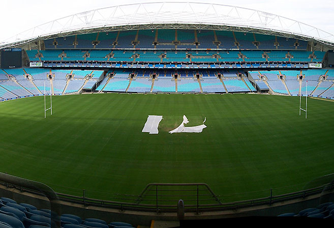 An empty ANZ Stadium with rugby posts configuration