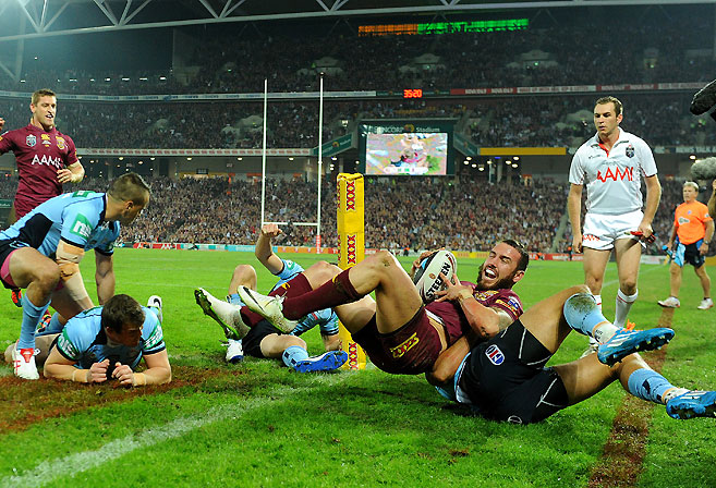 Queensland's Darius Boyd scores a try during Game I of the 2014 State of Origin rugby league series at Suncorp Stadium in Brisbane, Wednesday, May 28, 2014. (AAP Image/Dave Hunt)