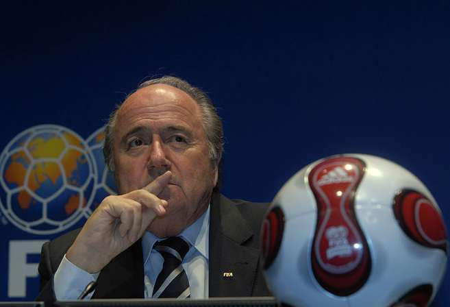 Sepp Blatter listens during a press conference