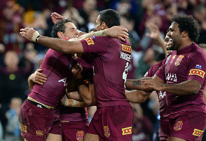 Queensland players celebrate Billy Slater's try during Game 3 of the 2014 State of Origin Series. (AAP Image/Dan Peled)